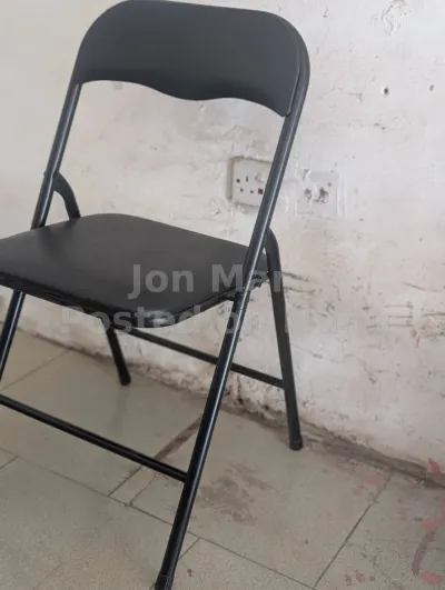 black foldable metallic chairs