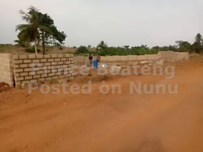 Two plots of land by the roadside for sale